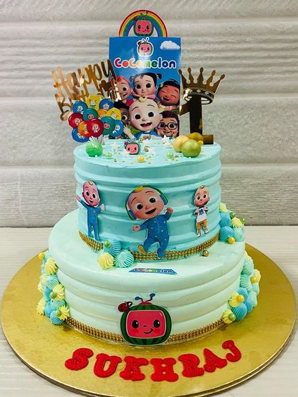 A slightly different view of the two-tiered Cocomelon cake, showcasing the fun and festive design that kids absolutely love.