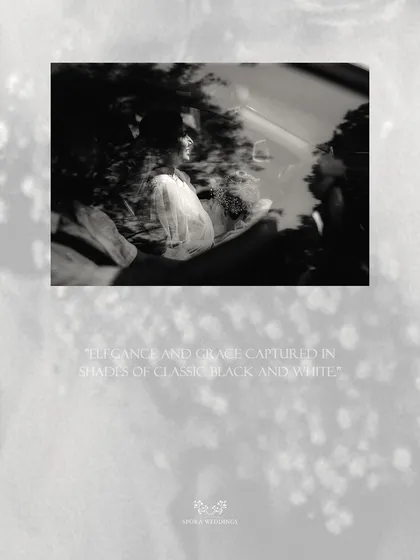An abstract black and white shot of the couple in their car, capturing a moment of elegance and grace.