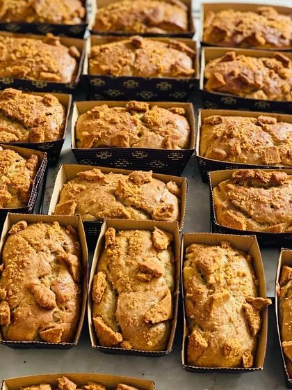 A batch of my popular Biscoff banana mini loaves, fresh from the oven. The combination of moist banana bread and crunchy, caramelized Biscoff biscuit topping is absolutely delicious.