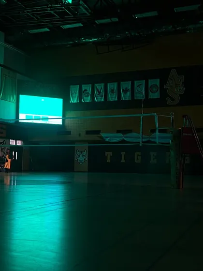 The calm before the storm. An empty indoor court at the American Embassy School, waiting for the action to begin. This is one of the many venues where our teams compete.