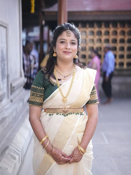 This is a lovely Varapooje or Muhurtham look, featuring a classic Kerala saree. I kept the makeup fresh and minimal to match the simple elegance of her attire, with a focus on clean skin and defined eyes.