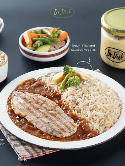 This is what a perfect meal looks like. You get delicious grilled chicken in our special fat-free gravy, served with brown rice and sautéed veggies. It's a balanced, high-protein meal that fuels your body right.
