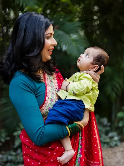 The way a baby looks up at their mother is a moment of pure connection. I captured this beautiful interaction during an outdoor portrait session at a naming ceremony.