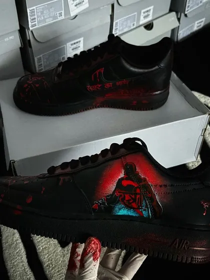A full view of the "Stree 2" custom sneakers, showing the menacing character art.