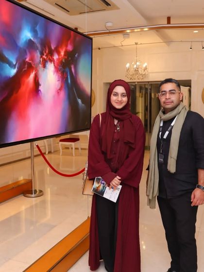 The founder of Rubix Collective with an upcoming artist at the 'Mystic Mirage' opening, highlighting the networking opportunities at our events.