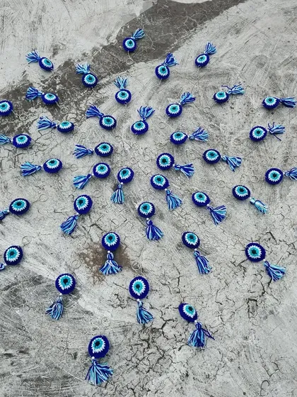 An artistic shot of the evil eye keychains from my first bulk order.