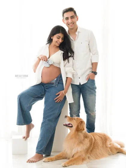 Because pets are family too. This relaxed maternity session captures the complete family, including their beloved golden retriever, as they wait for their new arrival. It's a casual, love-filled portrait that tells their whole story.