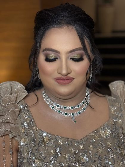 An eyes-closed shot to showcase the beautiful blend of gold and brown eyeshadows. This is a classic glam eye that suits any festive occasion.