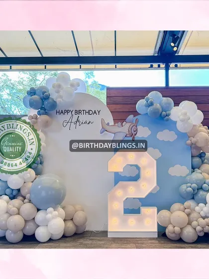 This shot captures the entire airplane-themed setup, perfect for a memorable second birthday.