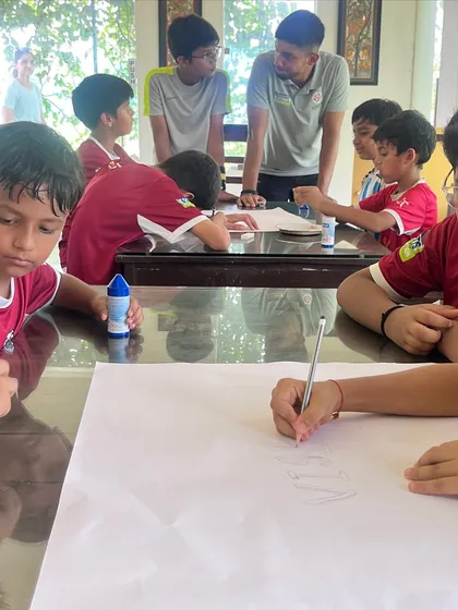 A team bonding session where players work together on a creative project. We build teamwork and communication skills both on and off the field.