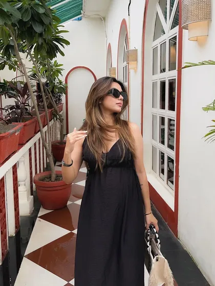 A classic walking shot, showing the flow of the dress.