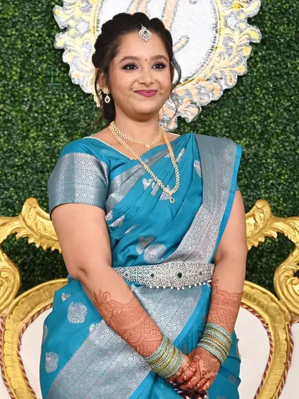 Jebha's engagement look, with her welcoming guests with a traditional namaste. Her makeup is fresh and radiant.