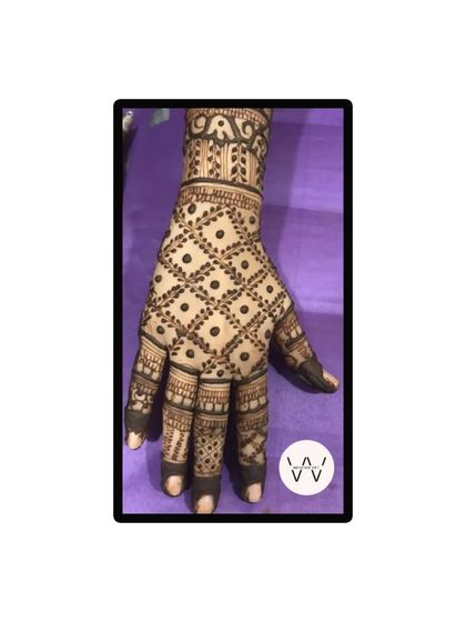 A close-up of the jaal pattern on the back of the hand for Karwachauth.