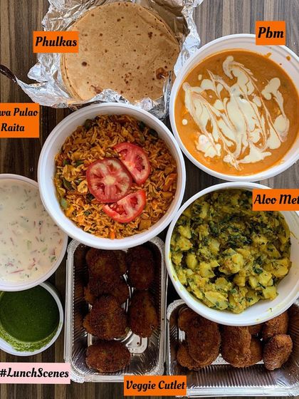 A delicious lunch scene from my kitchen. This meal features Tawa Pulao with Raita, creamy Paneer Butter Masala, Aloo Methi, soft Phulkas, and crispy Veggie Cutlets.