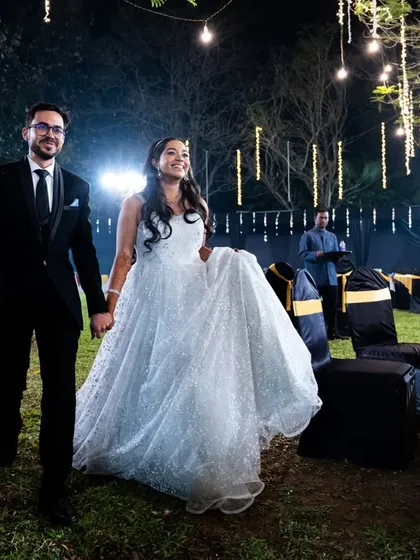 The couple makes their entrance at the cocktail party, looking elegant and happy.