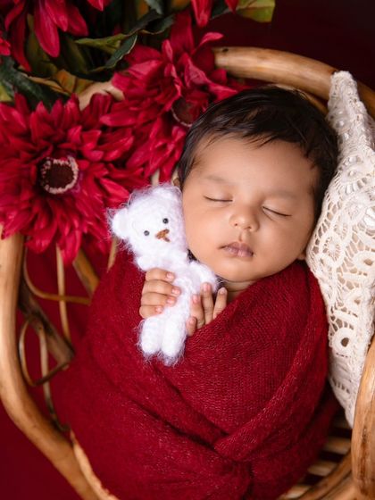 A beautiful portrait using a rich maroon color for the wrap and flowers, showing how to create a setup based on a parent's favorite color.