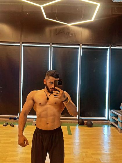 A confident selfie in the gym. This is the look of someone who is proud of the work they've put in.