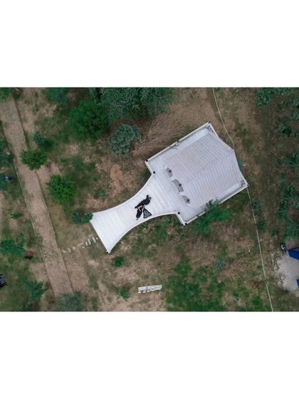 The 'Before' shot of a property. This aerial image documents the initial state of the land before the landscaping and construction work began.