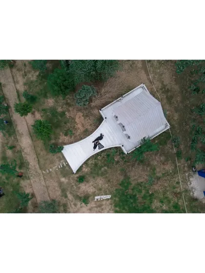 The 'Before' shot of a property. This aerial image documents the initial state of the land before the landscaping and construction work began.