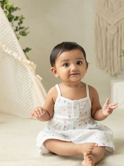 My boho-themed sessions use natural textures like macrame, wood, and greenery to create a calm and earthy setting that beautifully complements your child's simple joy.