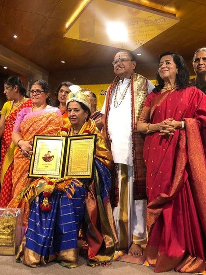 Surrounded by friends and well-wishers during a felicitation ceremony. The support of the community is the greatest award an artist can receive.