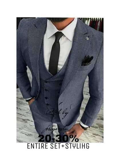 A classic three-piece suit in a textured blue fabric, styled for a sharp and modern professional look.