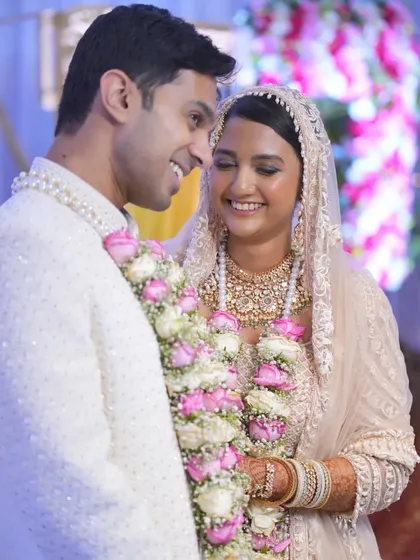 Another angle capturing the genuine smiles and connection between the newly married couple.