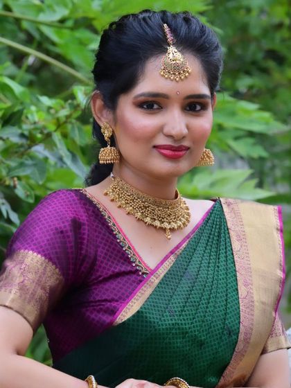 A beautiful client ready for her engagement. The look features a golden smokey eye, a warm lip color, and traditional temple jewellery that pairs perfectly with her Kanchipattu saree.