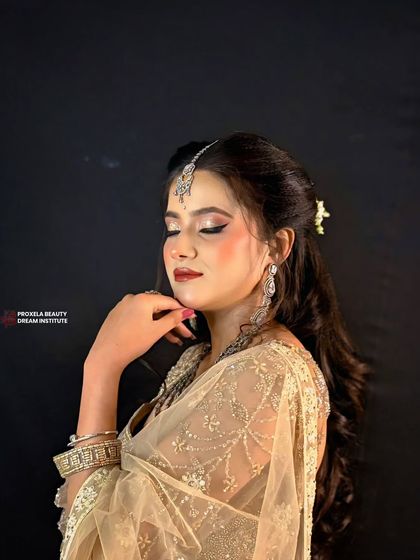 A serene and graceful pose. The makeup is designed to look soft and romantic, perfect for a daytime event or a pre-wedding photoshoot.