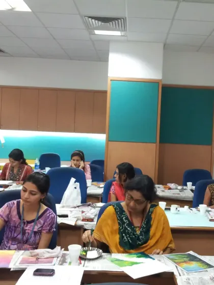 A view of the workshop in progress at Wipro. I bring all the materials, from canvases and paints to aprons, so your team can just sit down and enjoy the experience. We can set up in any office space, turning it into a temporary art studio.