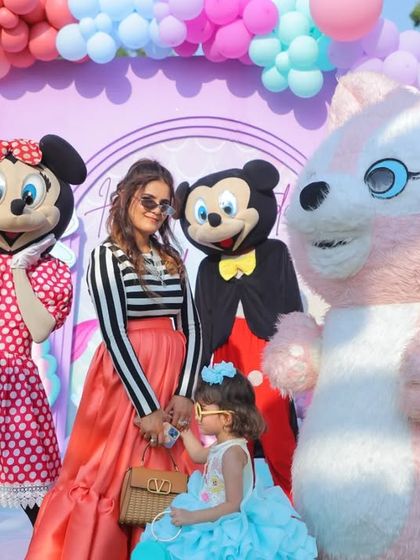 The birthday girl with her mom and character mascots. These are the magical moments that make a themed party so special, and I make sure to capture these interactions.