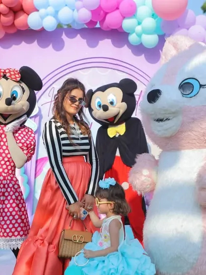 The birthday girl with her mom and character mascots. These are the magical moments that make a themed party so special, and I make sure to capture these interactions.
