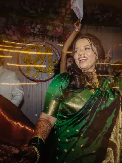 A joyful, candid shot of the bride dancing at her engagement. The makeup is designed to withstand all the fun and celebration, keeping her looking radiant.