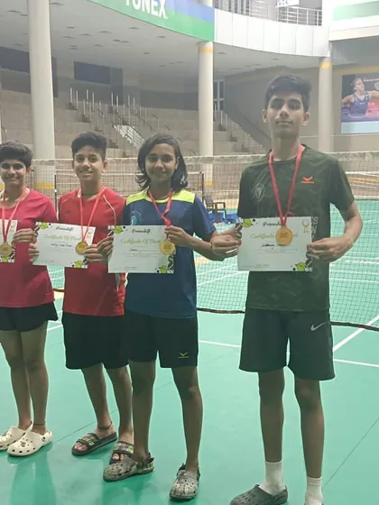 Our players showcasing their medals and certificates after a successful tournament. This image features winners and runners-up from the Primeshift Badminton tournament, including Sneha (Winner GS U-18) and Siddhant Thakur (Winner BS U-15).