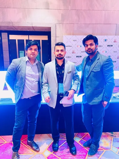Networking with colleagues at the Acetech exhibition. These interactions are valuable for sharing knowledge and staying updated on industry trends.
