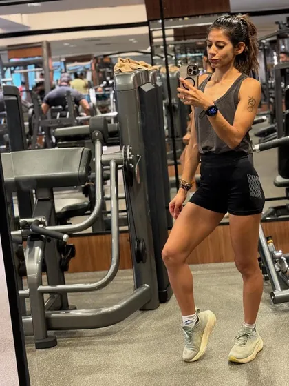 In the gym, surrounded by the tools of the trade. This is my happy place, where I build myself stronger, rep by rep.