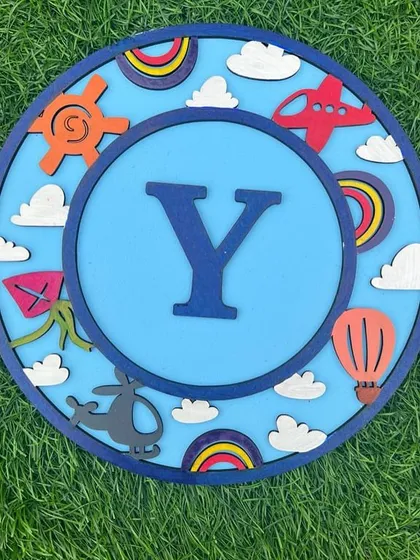 A different version of our travel-themed monogram for the letter "Y". The bright colors and fun elements make this a cheerful addition to any room.