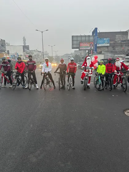 The entire group of riders and Santas lined up on a foggy Christmas morning, ready for the charity ride.