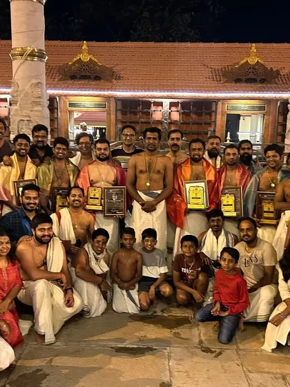 The entire Kalavadhyam Kshethra Vaadhya Kala Sangham family together after a performance, celebrating our shared art.