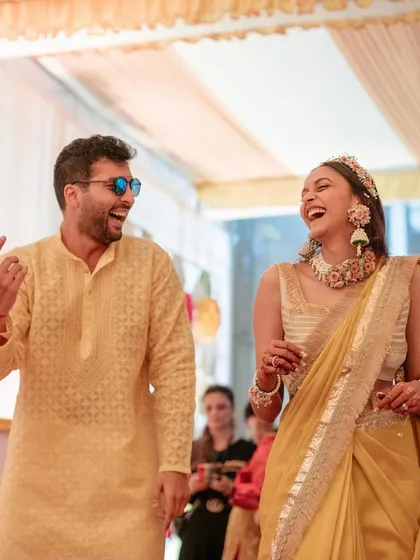 Nishita and Vishrut make a grand entrance at their haldi, laughing as Vishrut embraces the dhol beat. Their shared joy is infectious and makes for a wonderful, candid moment.