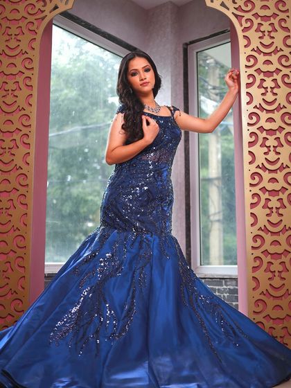 This blue fish-cut gown with sequin details is perfect for a glamorous evening event.