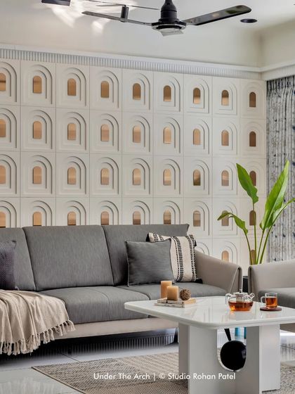A closer view of the feature wall, where the interplay of the repeating arch motif creates a sense of rhythm and depth.