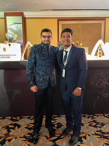 With a guest at a wedding reception. We ensure our team is professionally dressed to match the formality of your event.