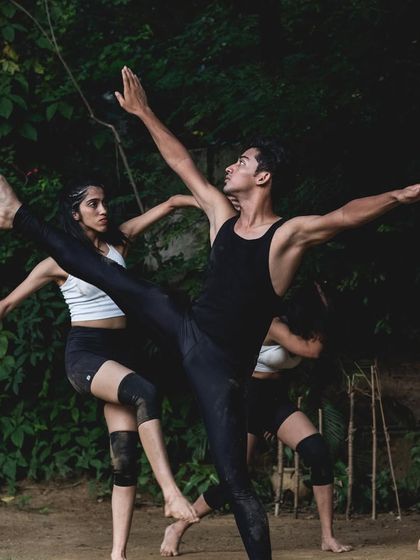 An outdoor contemporary performance showing a powerful lift and extension. We often take dance outside the studio to explore movement in different environments, focusing on organic and flawless execution.