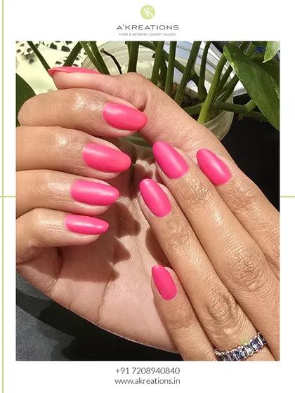 A classic look with a modern twist. These perfectly shaped almond nails are coated in a vibrant, solid pink with a smooth matte finish for a chic and velvety look.