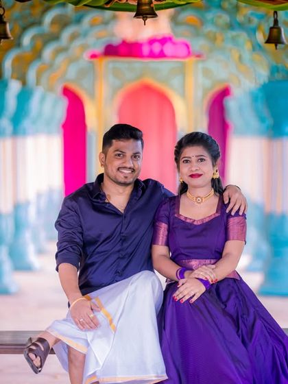 A couple in traditional South Indian attire on a swing, perfectly complementing the vibrant colors of our Jaipuri palace set.