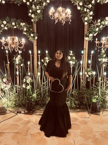 A final shot of the client in her black fish-cut gown. She looks absolutely beautiful and confident.