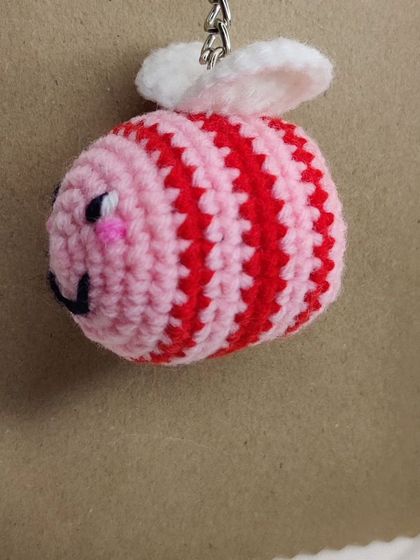 My super popular bumblebee keychains. They come in the classic yellow and black, but I also make them in fun colors like pink, blue, and purple.