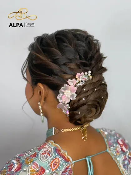 A close-up of the beautiful pink and white floral hairpiece, showing the detailed craftsmanship.