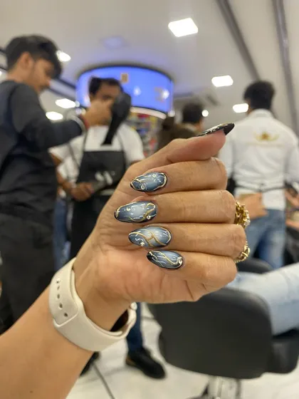 A close-up of the Korean swirls with diamond shine chrome, a popular and elegant design for any occasion.